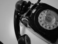 A vintage and antique telephone with white background.